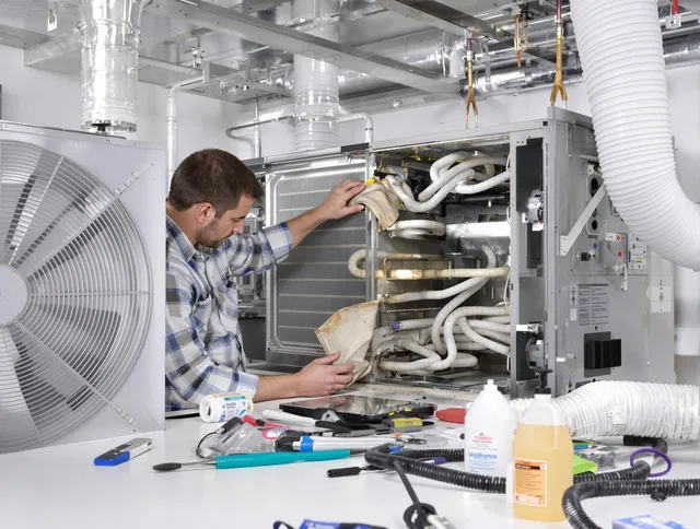 Holbrook Air Duct Cleaning specialist performing precision AC coil cleaning in Holbrook