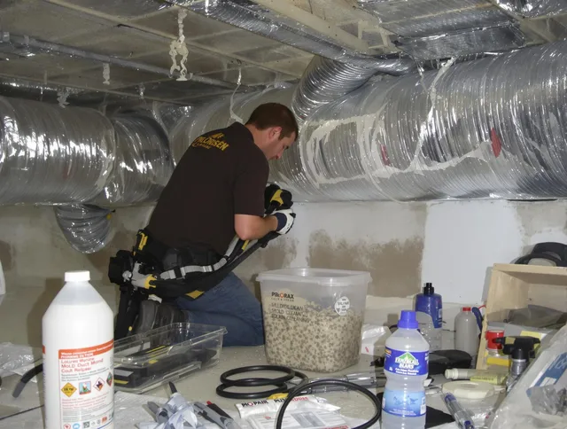 Holbrook Air Duct Cleaning specialist performing professional mold removal from air ducts in Holbrook
