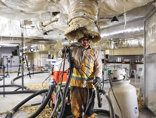 Professional vacuum insulation removal by Holbrook Air Duct Cleaning expert in Holbrook